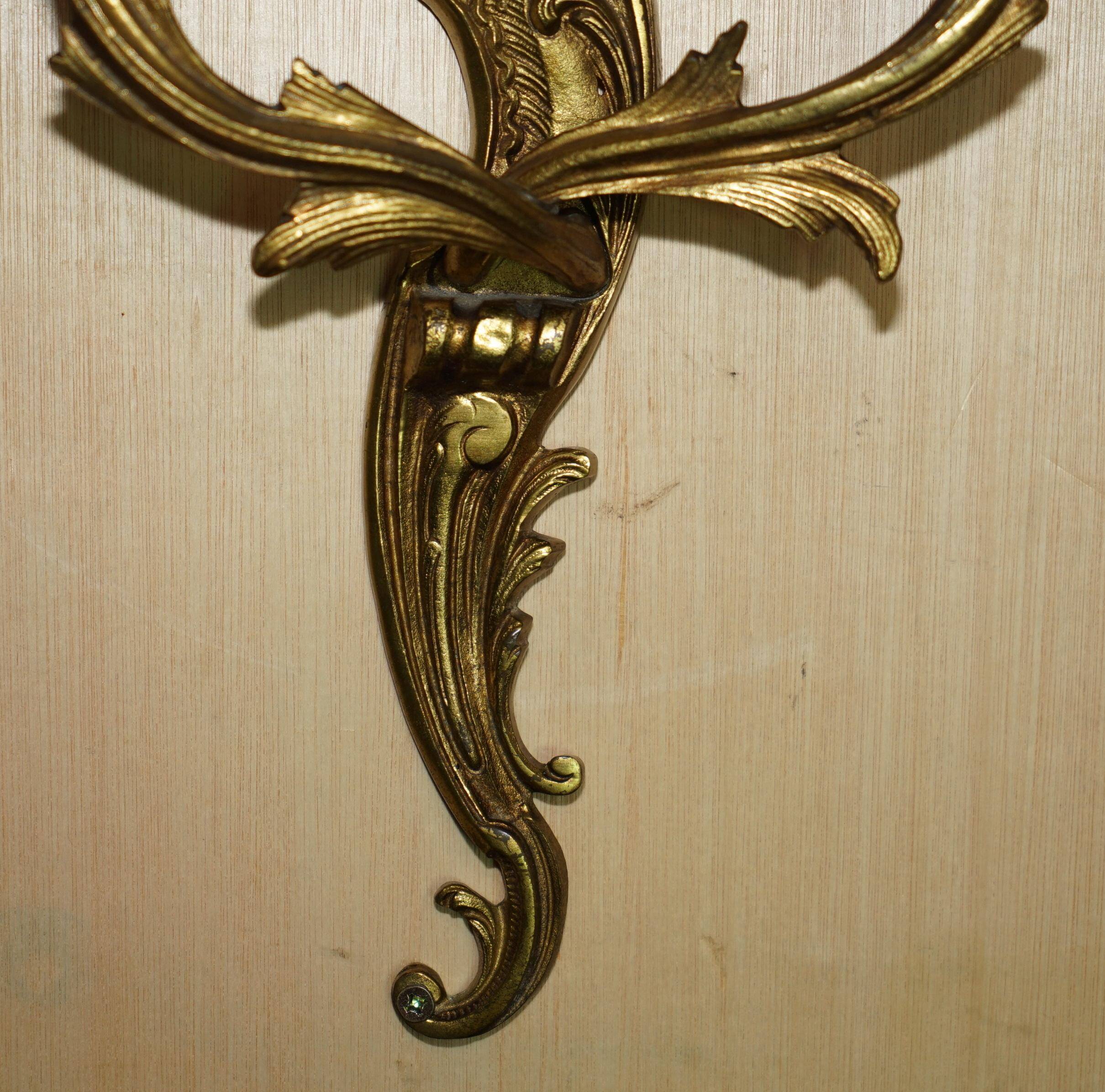 Pair of antique French wall sconces, gilded and bronzed, from the 1920s.