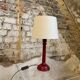 Brick/burgundy colored wooden bedside lamp duo
