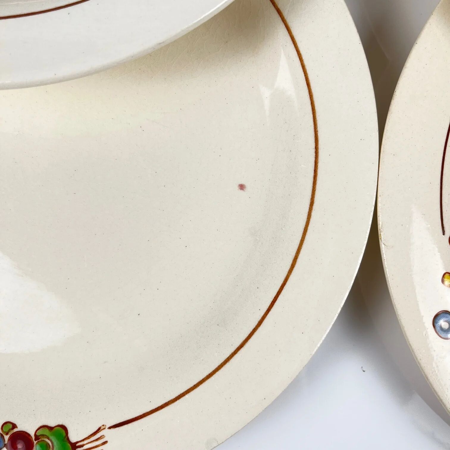 Set of 10 flat plates Longwy, 20th century, floral decoration.