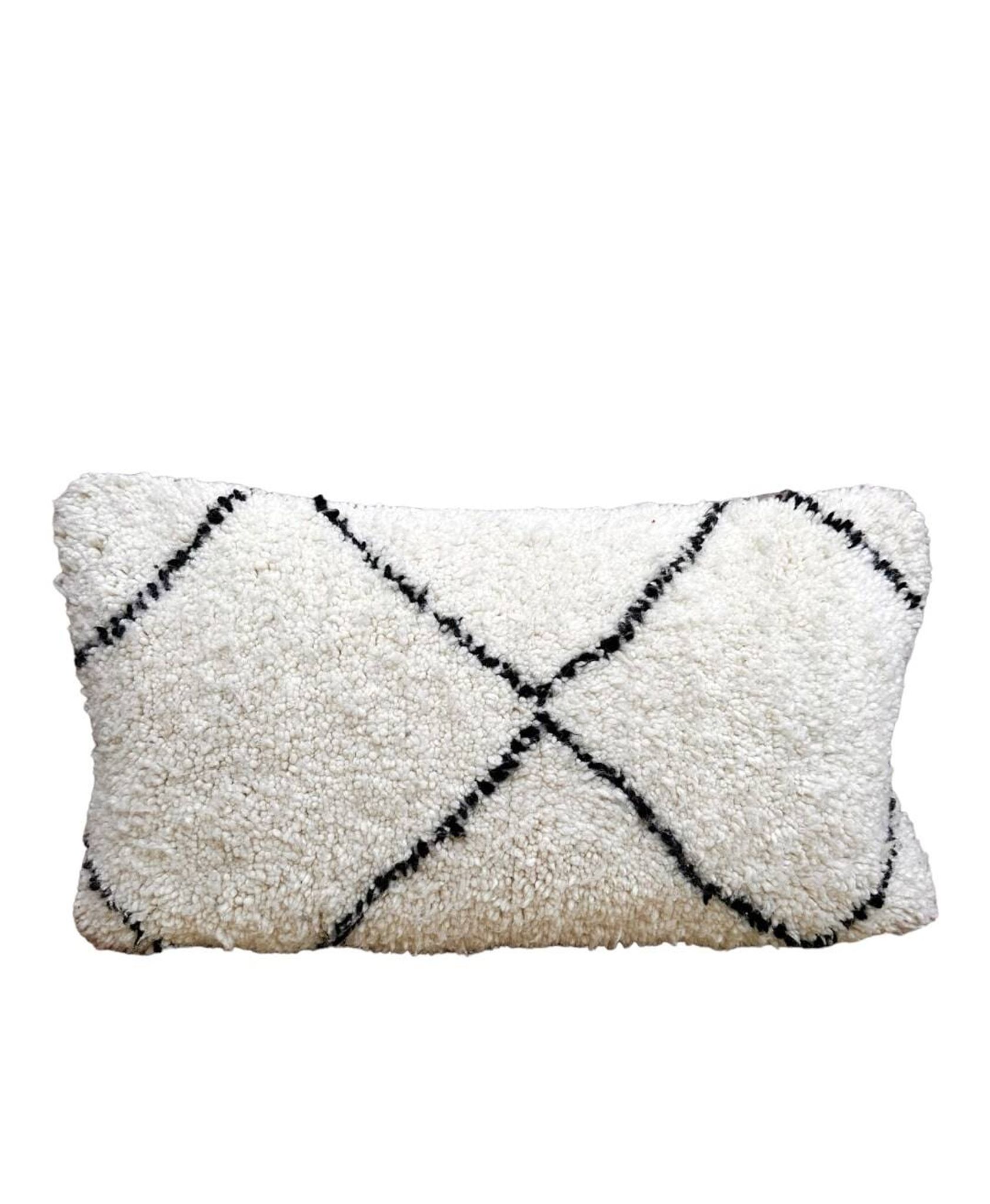 Bohemian wool pillow cover on a Beni Ourain Berber cushion. The cushion cover