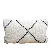 Bohemian wool pillow cover on a Beni Ourain Berber cushion. The cushion cover