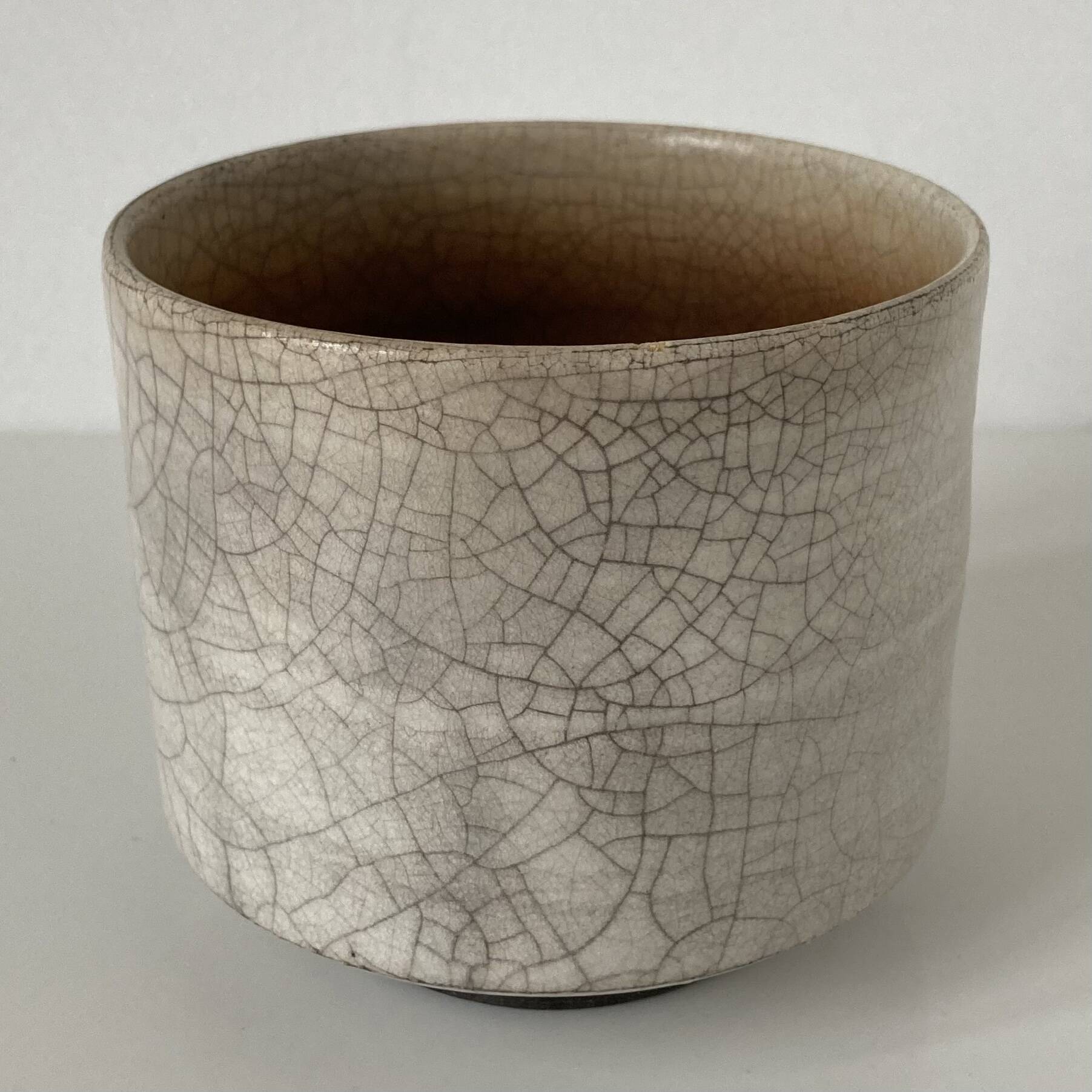 Traditional raku ceramic tea or matcha bowl with mark on the base