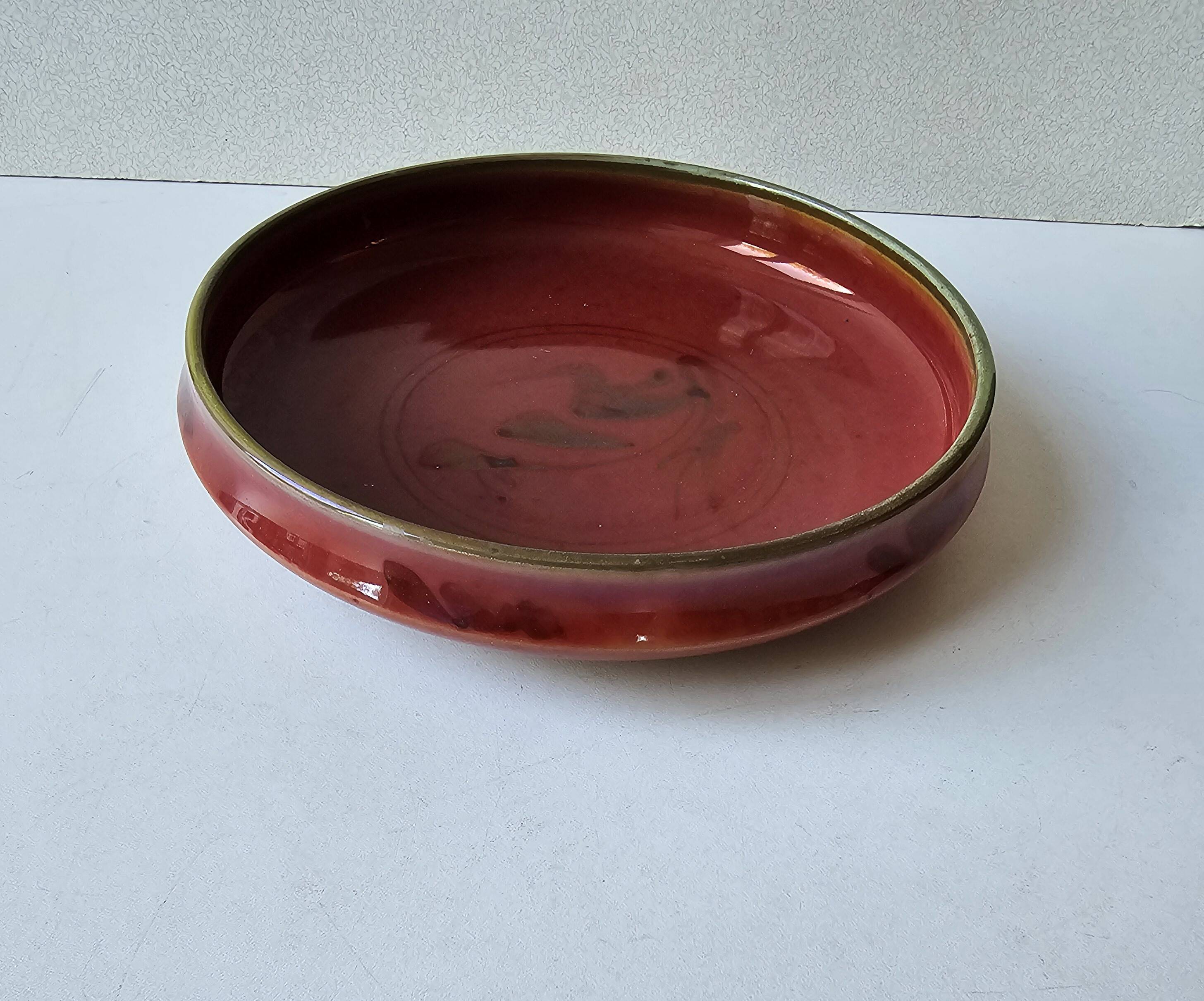 Red enamelled ceramic bowl emptier by Alain Déjardin
