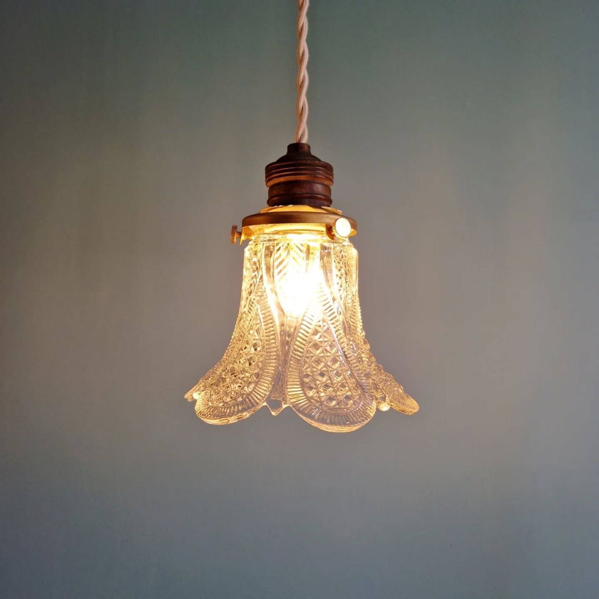 Art Deco trio of pendant lights/table lamps in clear glass, 1920s-30s.