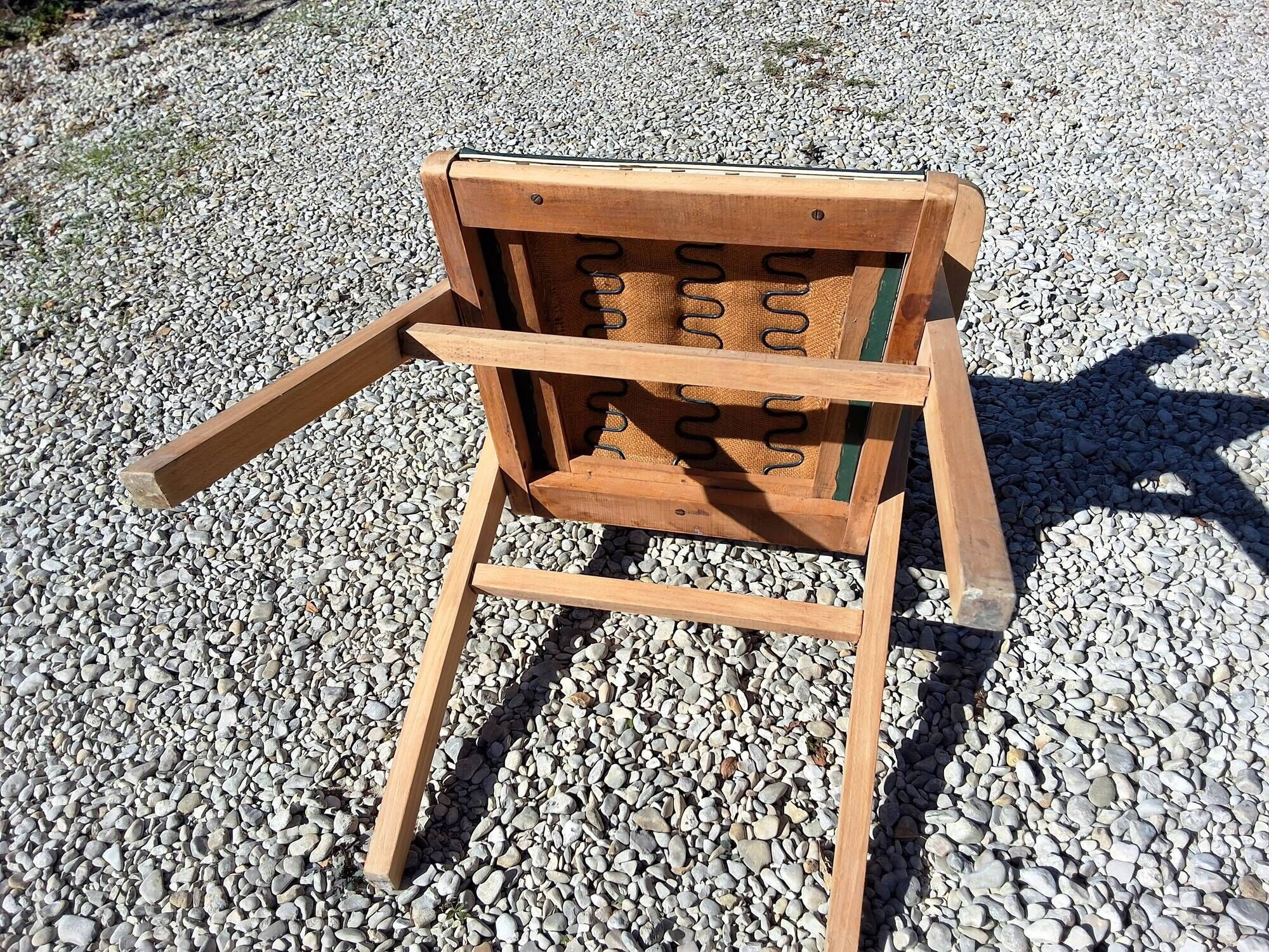 Compass leg armchair