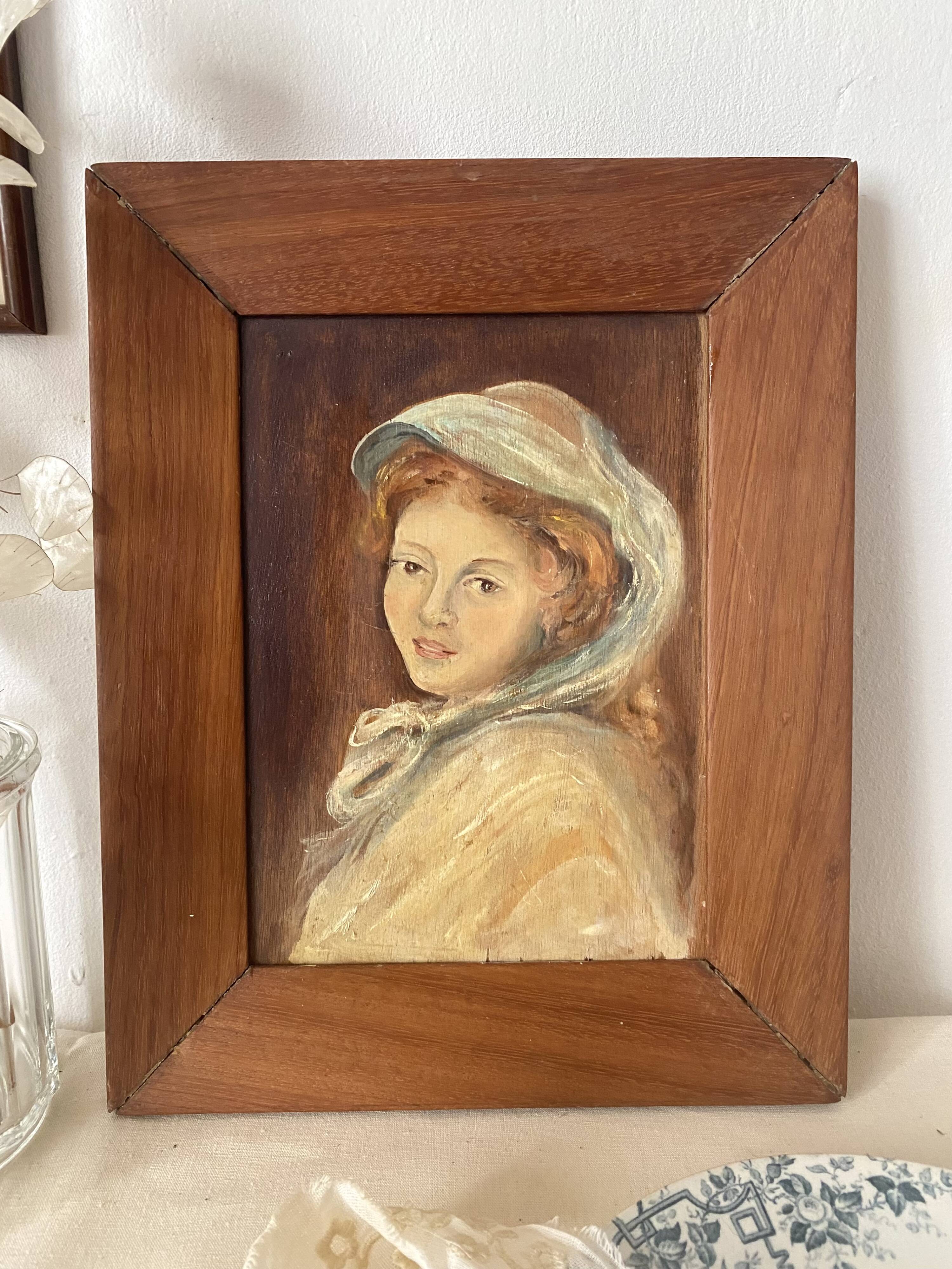 Old oil portrait on wood of a young woman