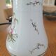 Vase en porcelaine décor polychrome "aux vieux chinois"