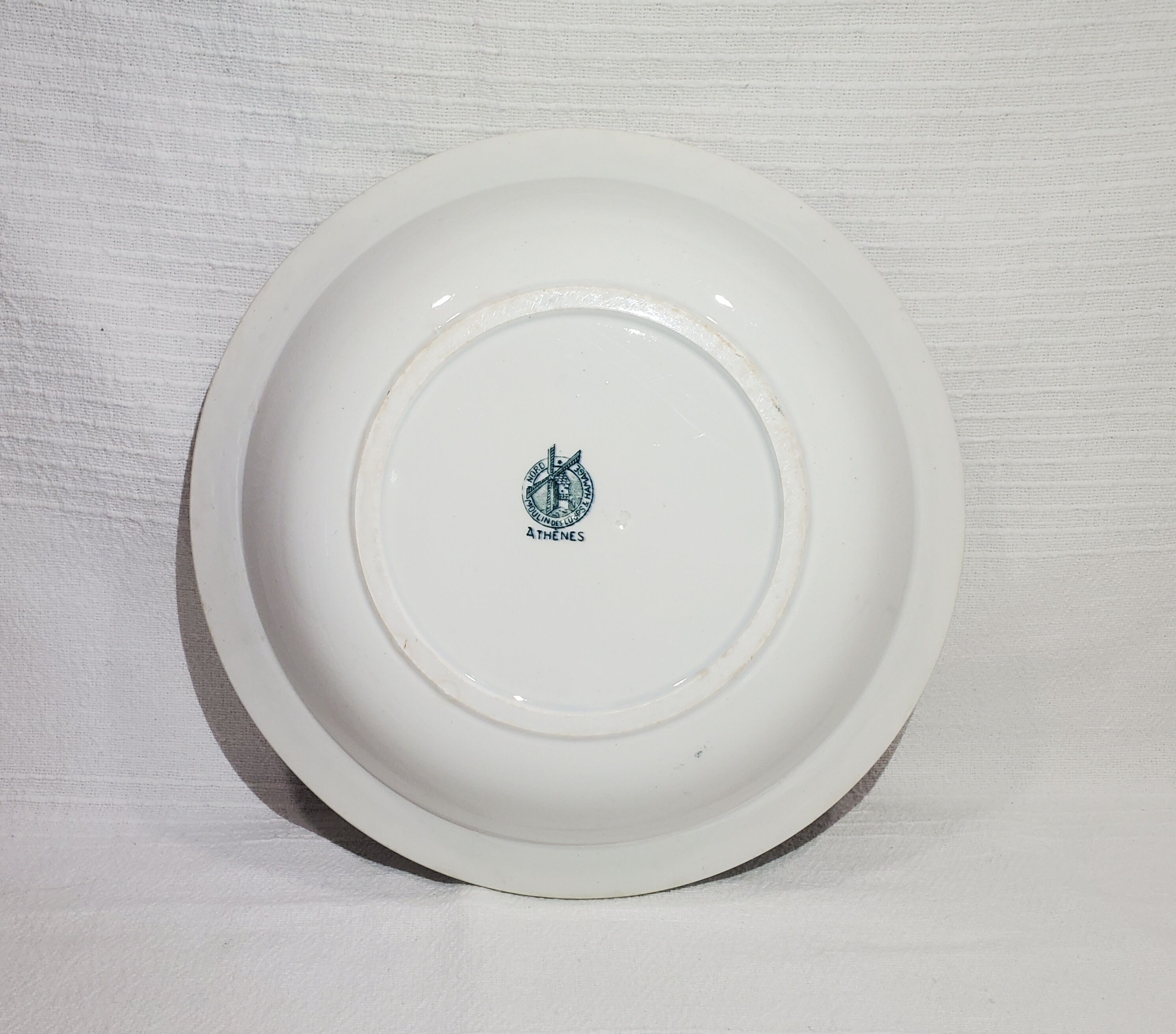 Large hollow earthenware dish of Moulin des Loups model Athens, iron earth