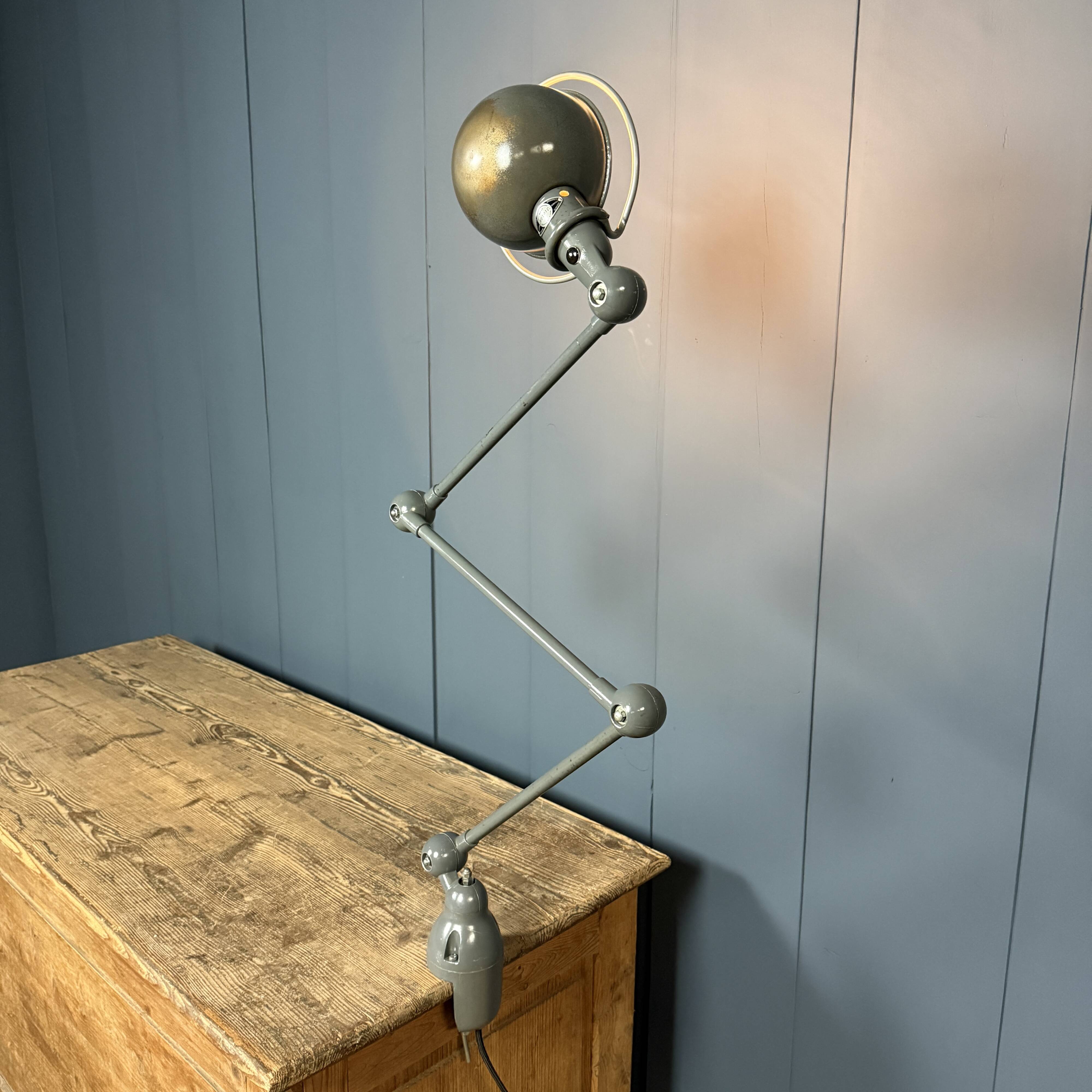 Dark grey Jielde three-arm clamp table lamp