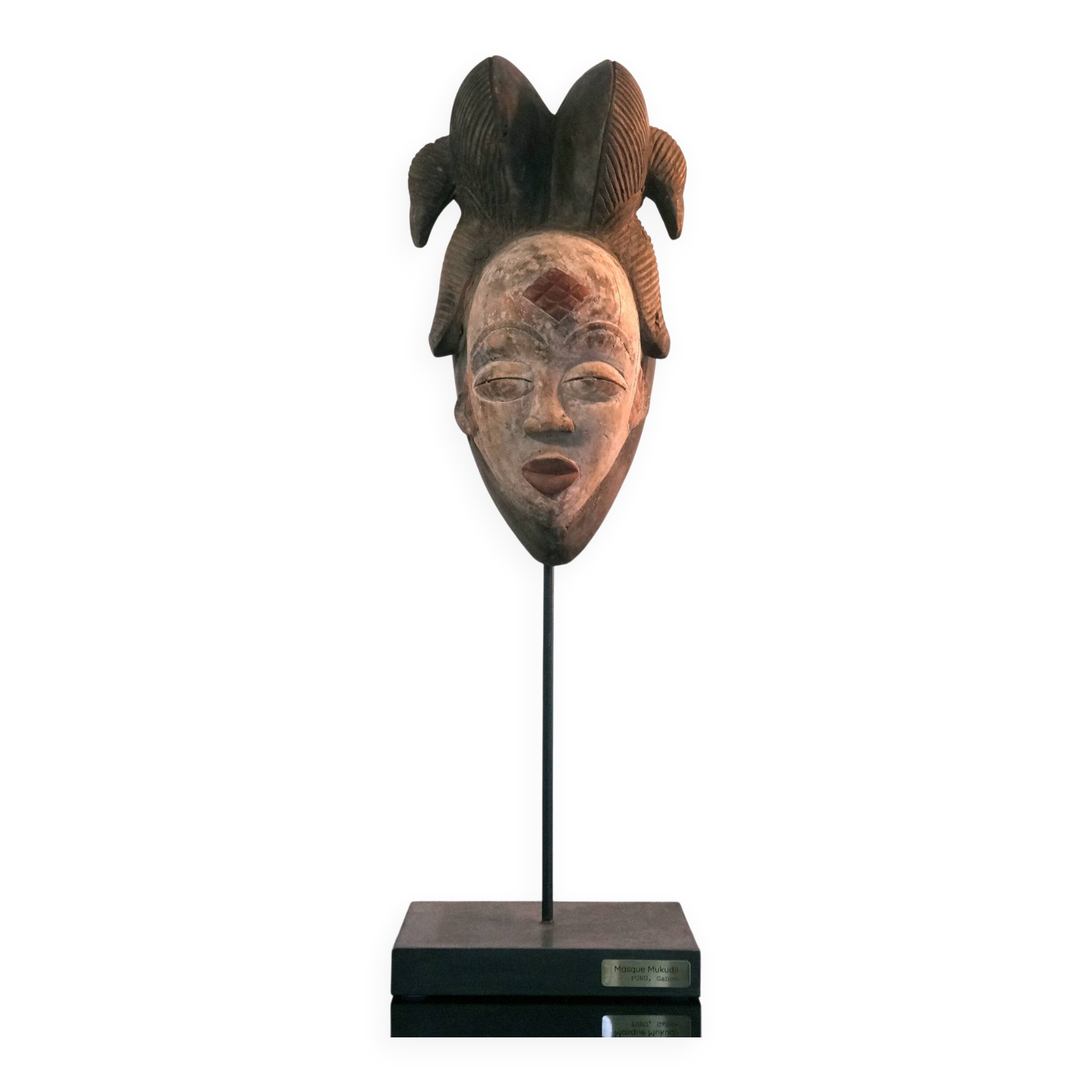 Punu mask on a base