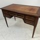 Louis XVI style desk in mahogany and mahogany veneer, 20th century.