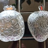 Two molded glass cups in the shape of strawberry and pineapple