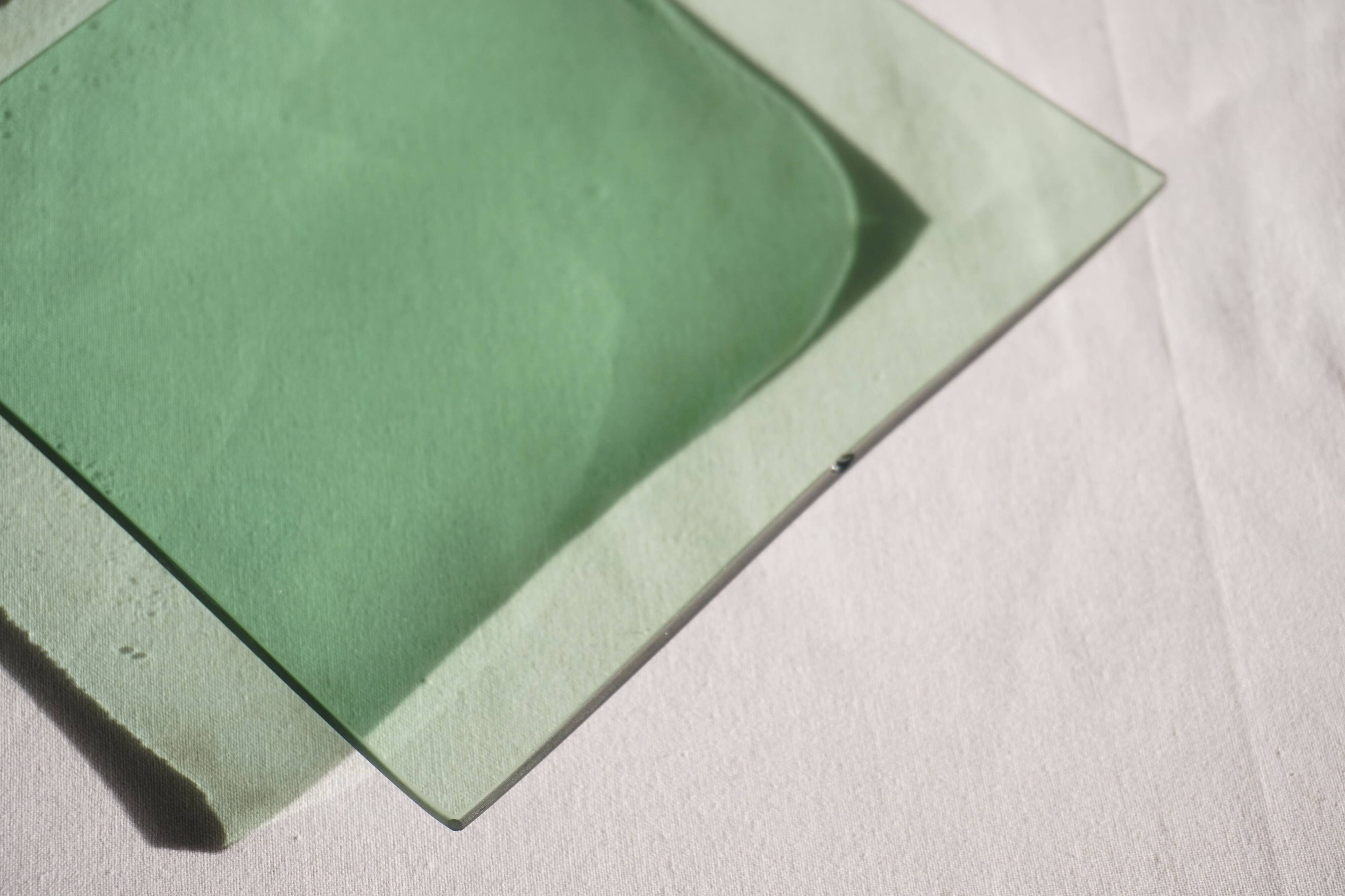 Set of 4 small square green glass plates/bowls