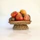 Straw dish on pedestal