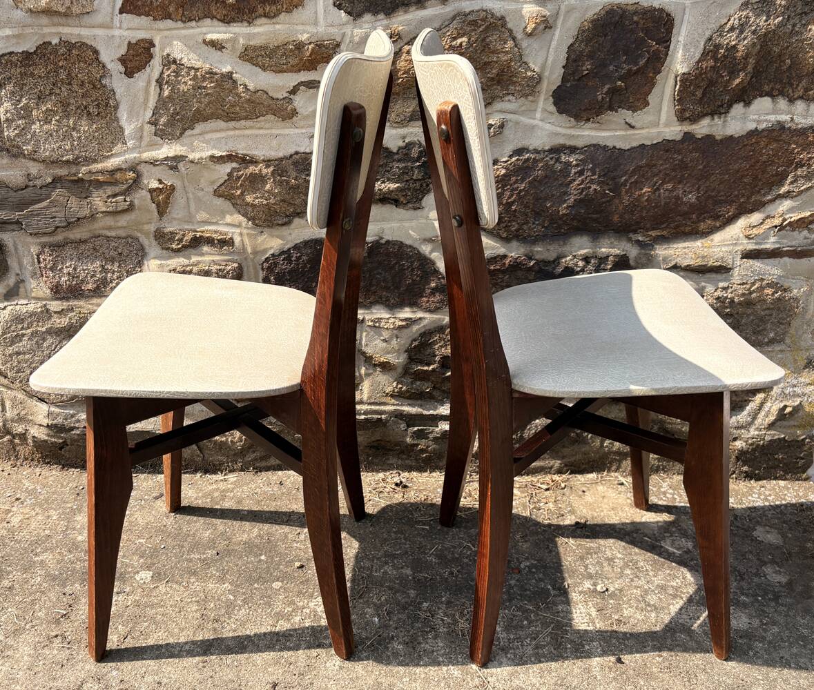 Pair of vintage chairs with upholstered backrest and seat, 1950s style.
