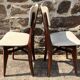 Pair of vintage chairs with upholstered backrest and seat, 1950s style.
