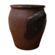 Old red and black terracotta grease pot