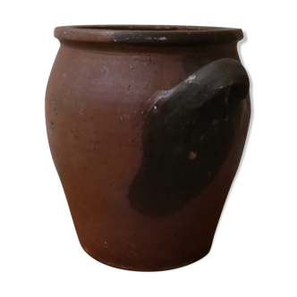 Old red and black terracotta grease pot