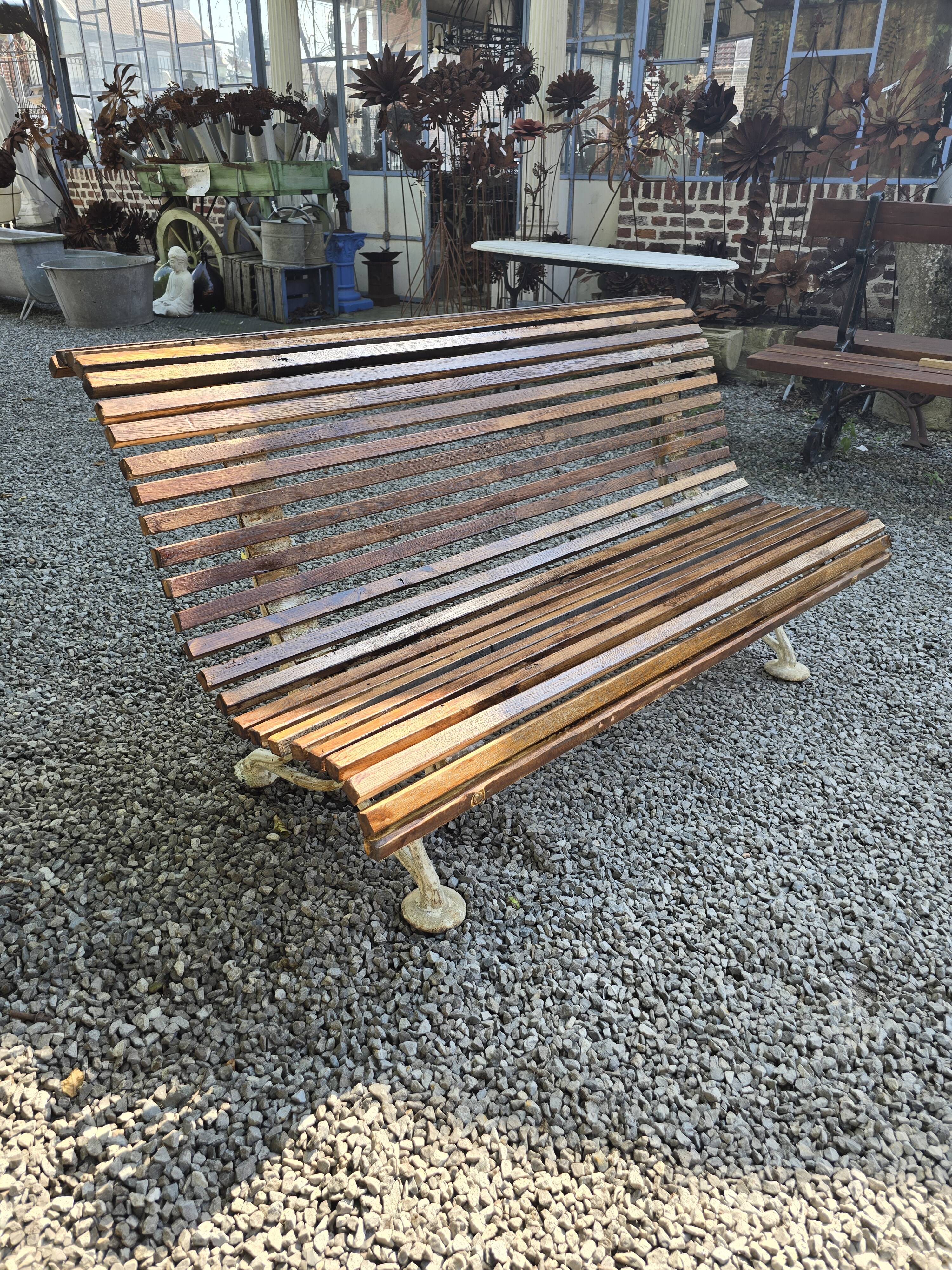 Garden bench with cast iron legs and oak slats