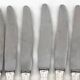 12 dessert, cheese, and hors d'oeuvre knives Grand Prix, Art Deco in silver-plated metal.