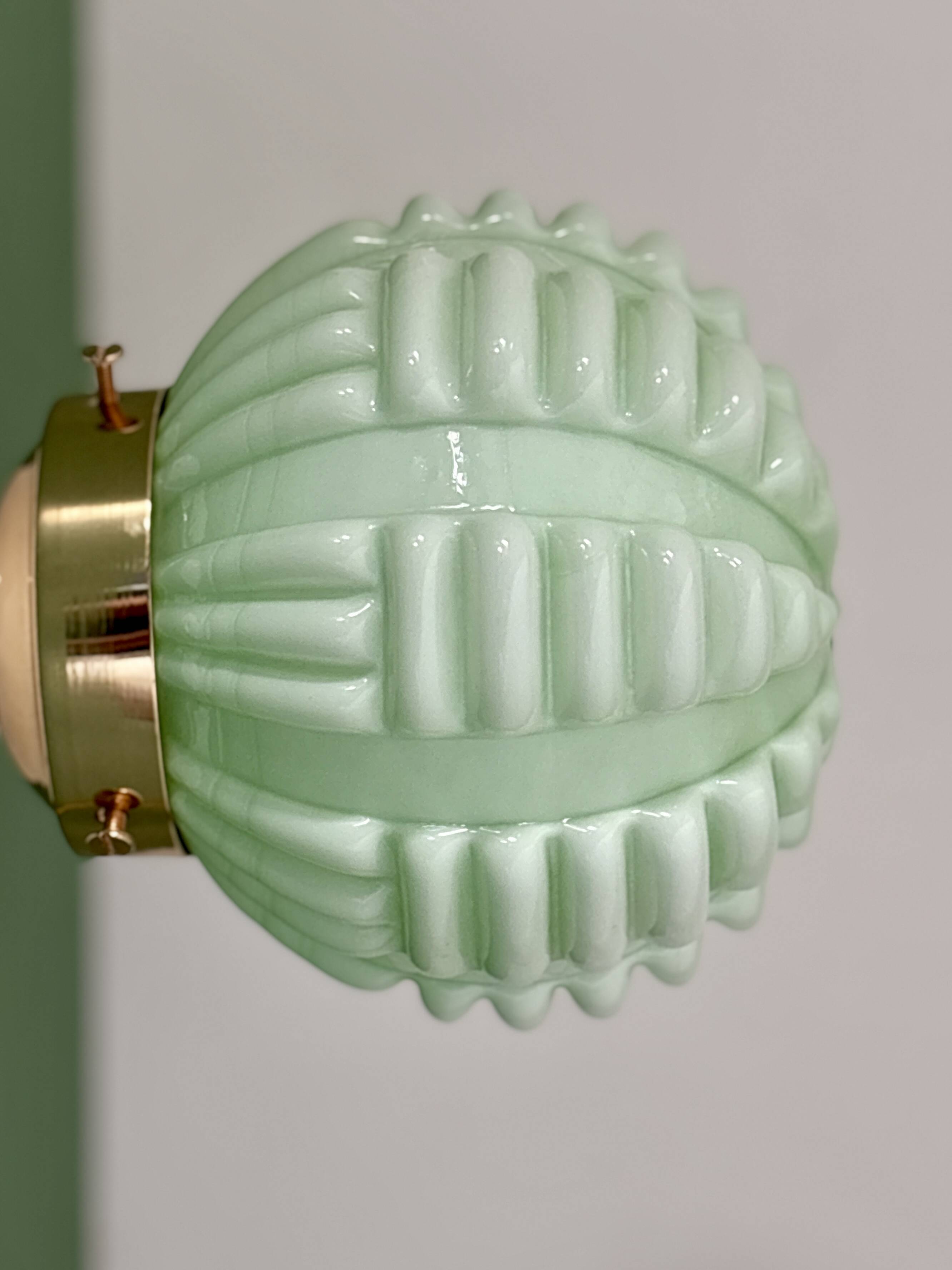 Vintage Art Deco globe wall light in pale green opaline.