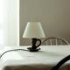 Lampe en céramique noire formant bougeoir