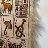 Vintage alphabet wall rug