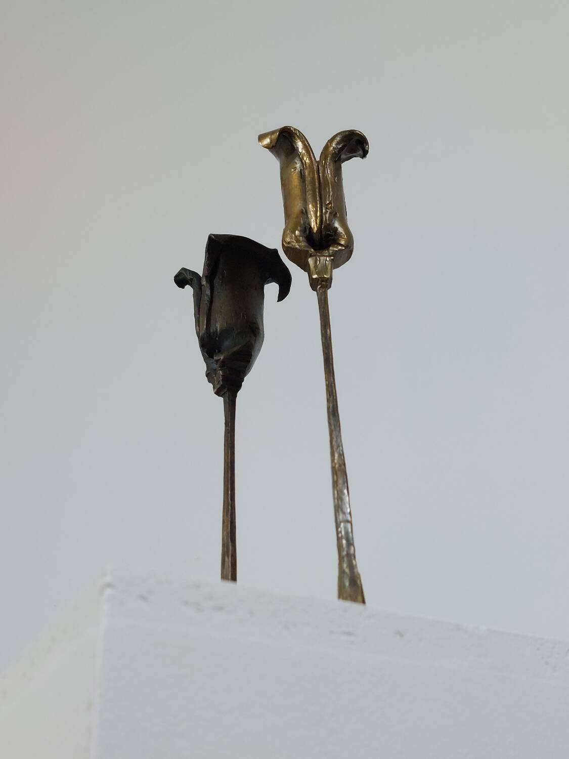 Pair of vintage brass candle holders with tulip decoration.