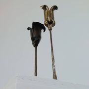 Pair of vintage brass candle holders with tulip decoration.