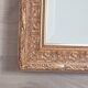 Miroir en bois stuc doré et verre biseauté