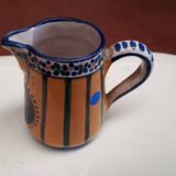 Small milk jug signed AR-H