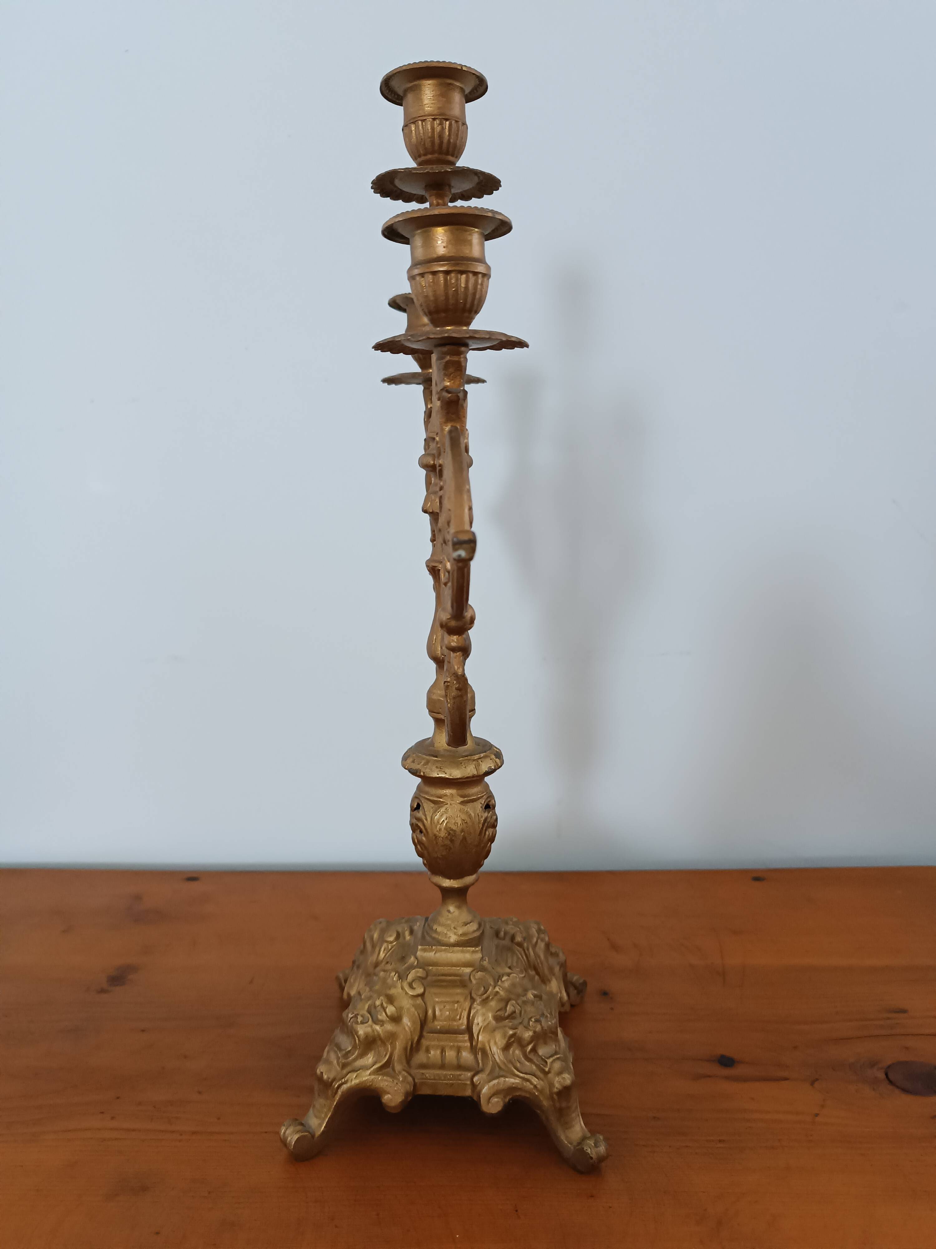 Bronze candlestick with lion head decoration