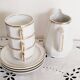 Set of 3 white and gold bistro coffee cups and coffee pot, in porcelain