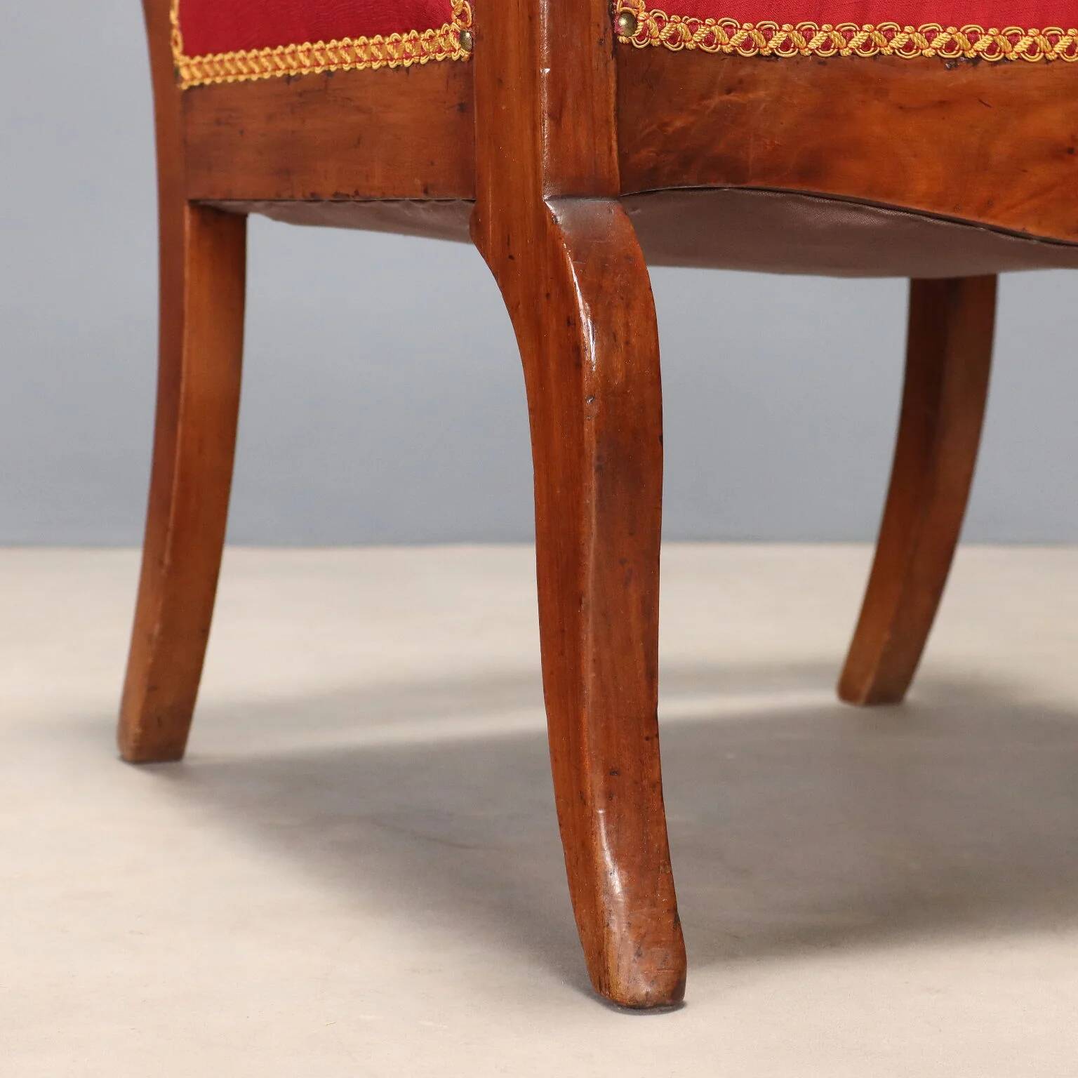 Antique Restoration-style armchair in walnut, fabric, Italy, 19th century.