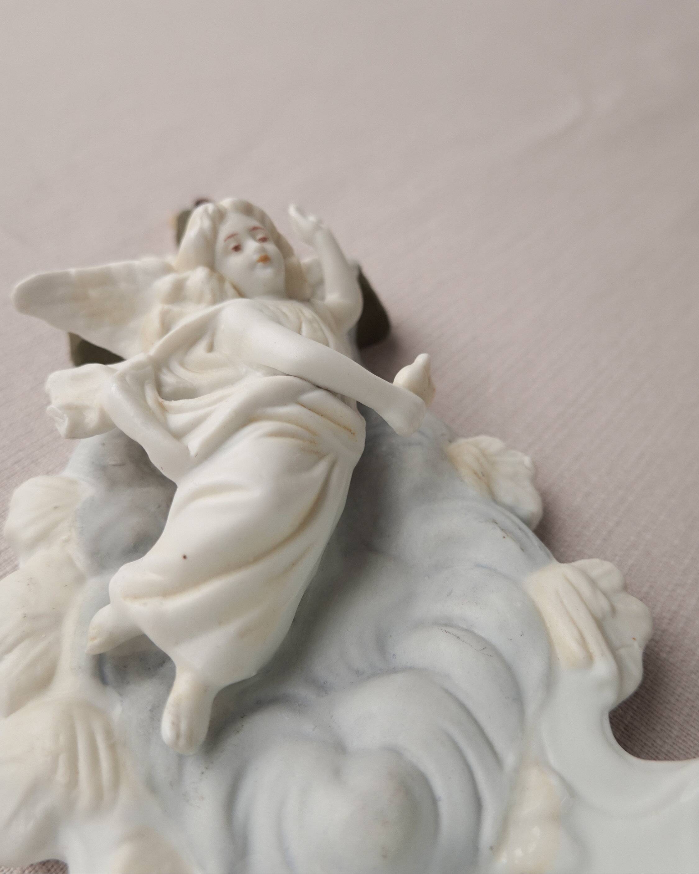 Wall angel holy water font