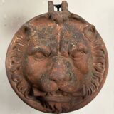 Three cast-iron and terracotta façade decoration lions, around 1880.