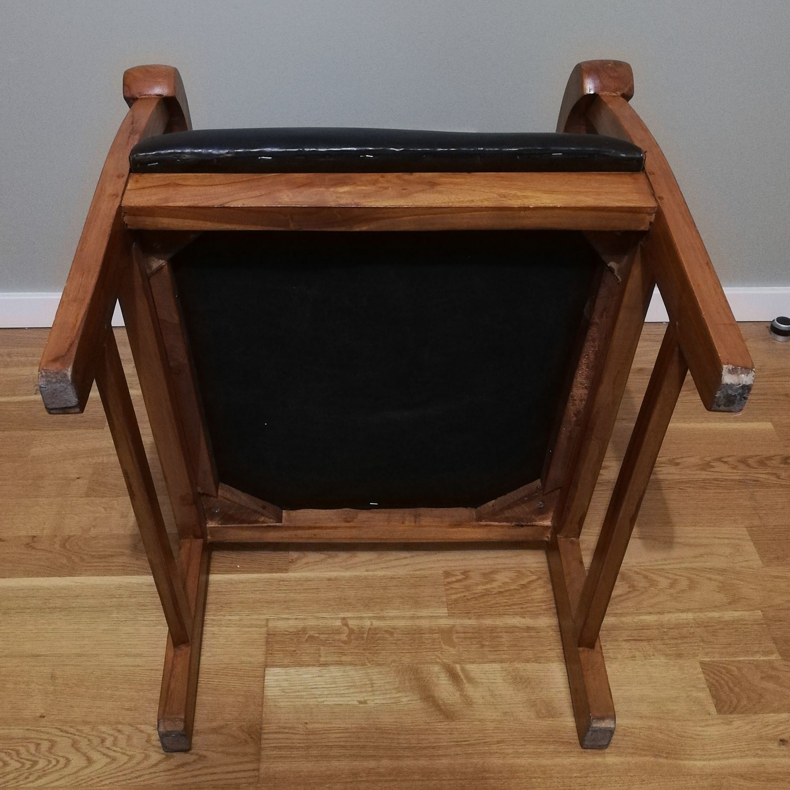 Colonial armchair in teak and black leather