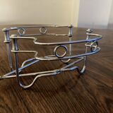 Chrome metal trivet by Tomado Holland