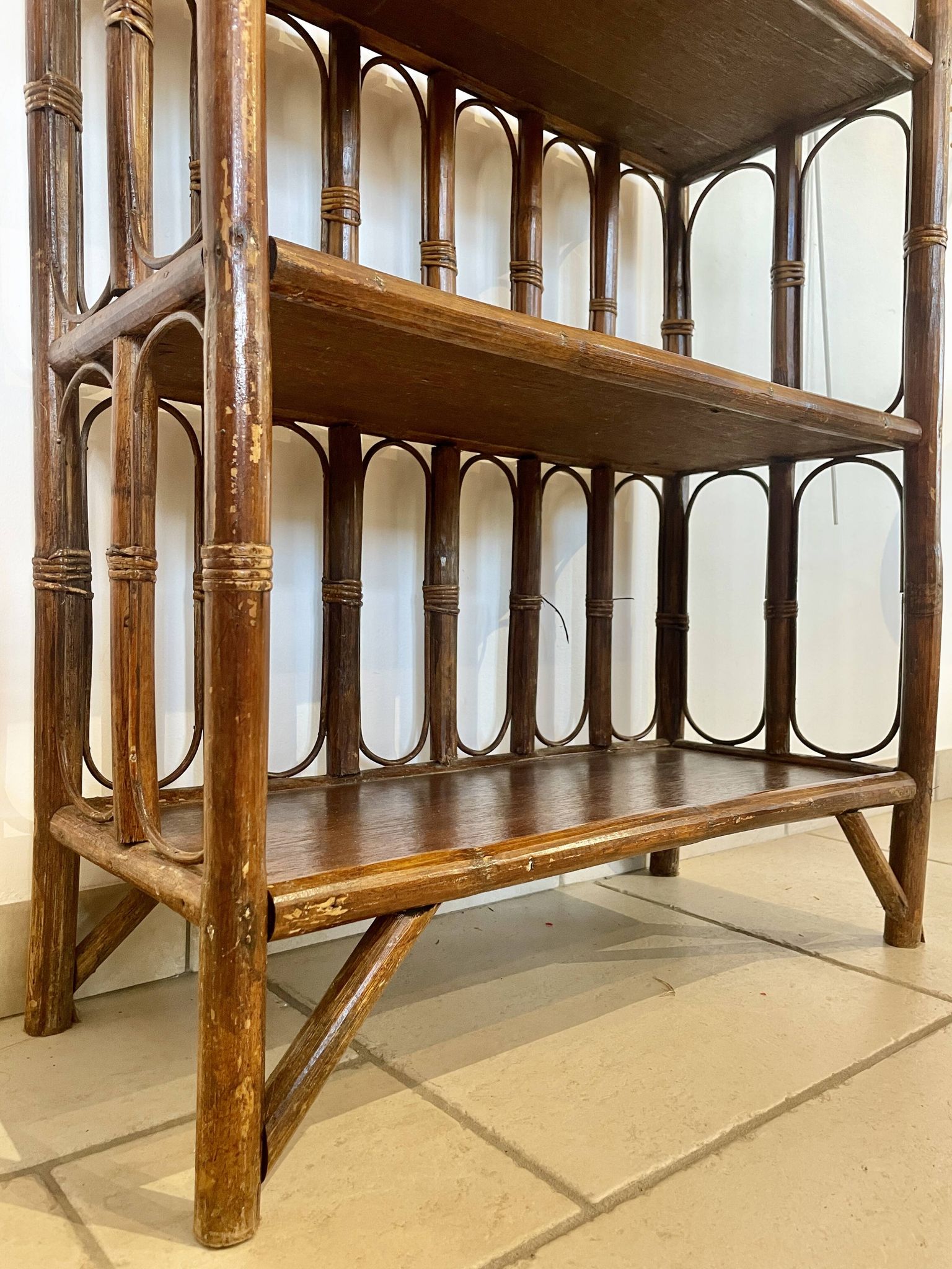 Shelf on rattan and bamboo legs from the 70s
