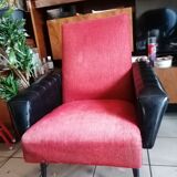 Red and black chair with brass feet
