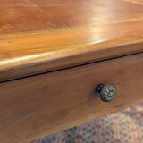 Cherry wood desk with a leather top.