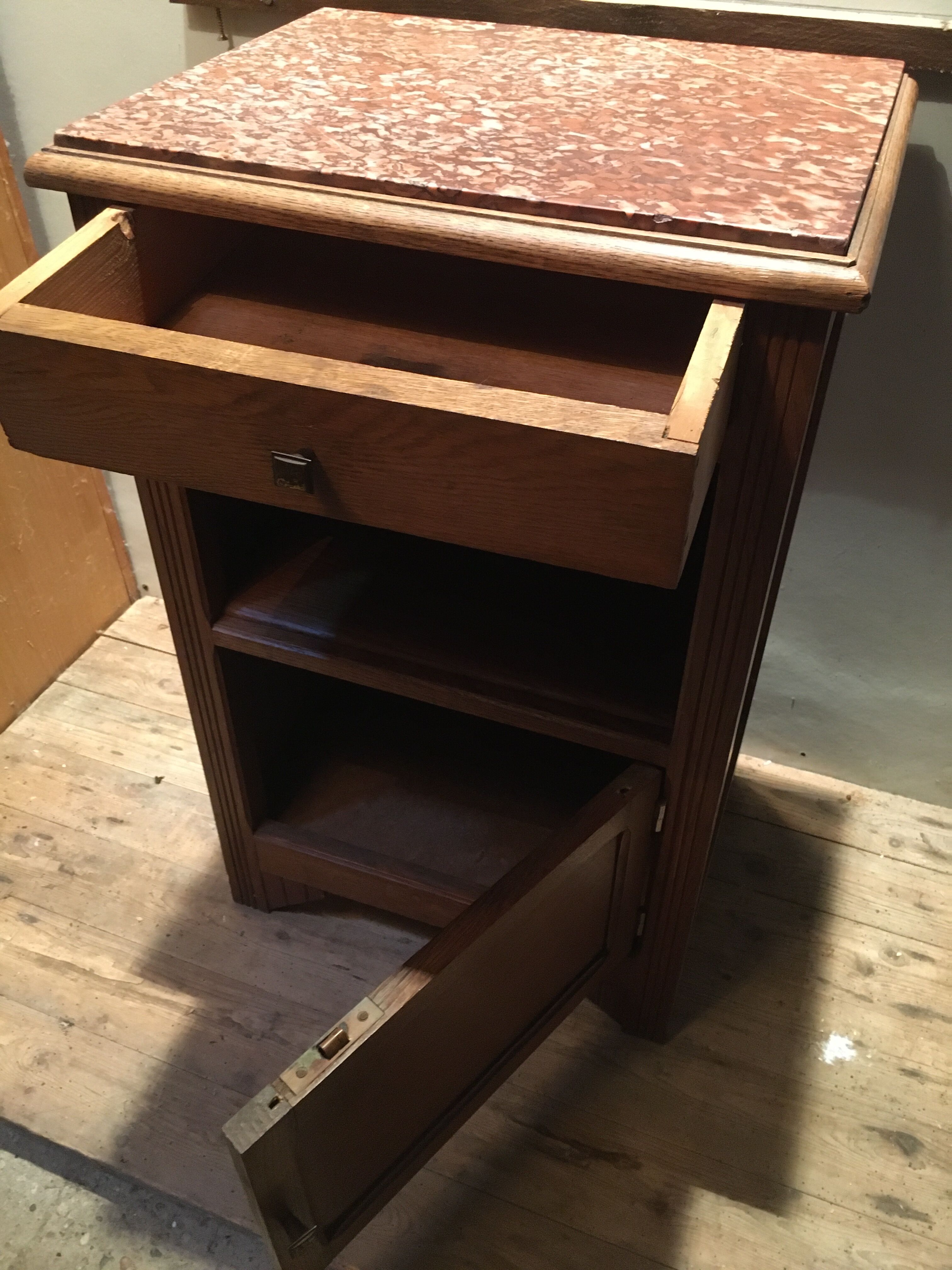 Solid oak bedside table with brown marble.