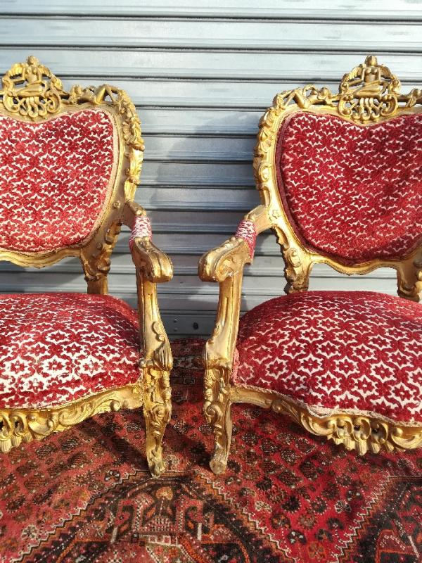pair of gilded wooden ceremonial chairs