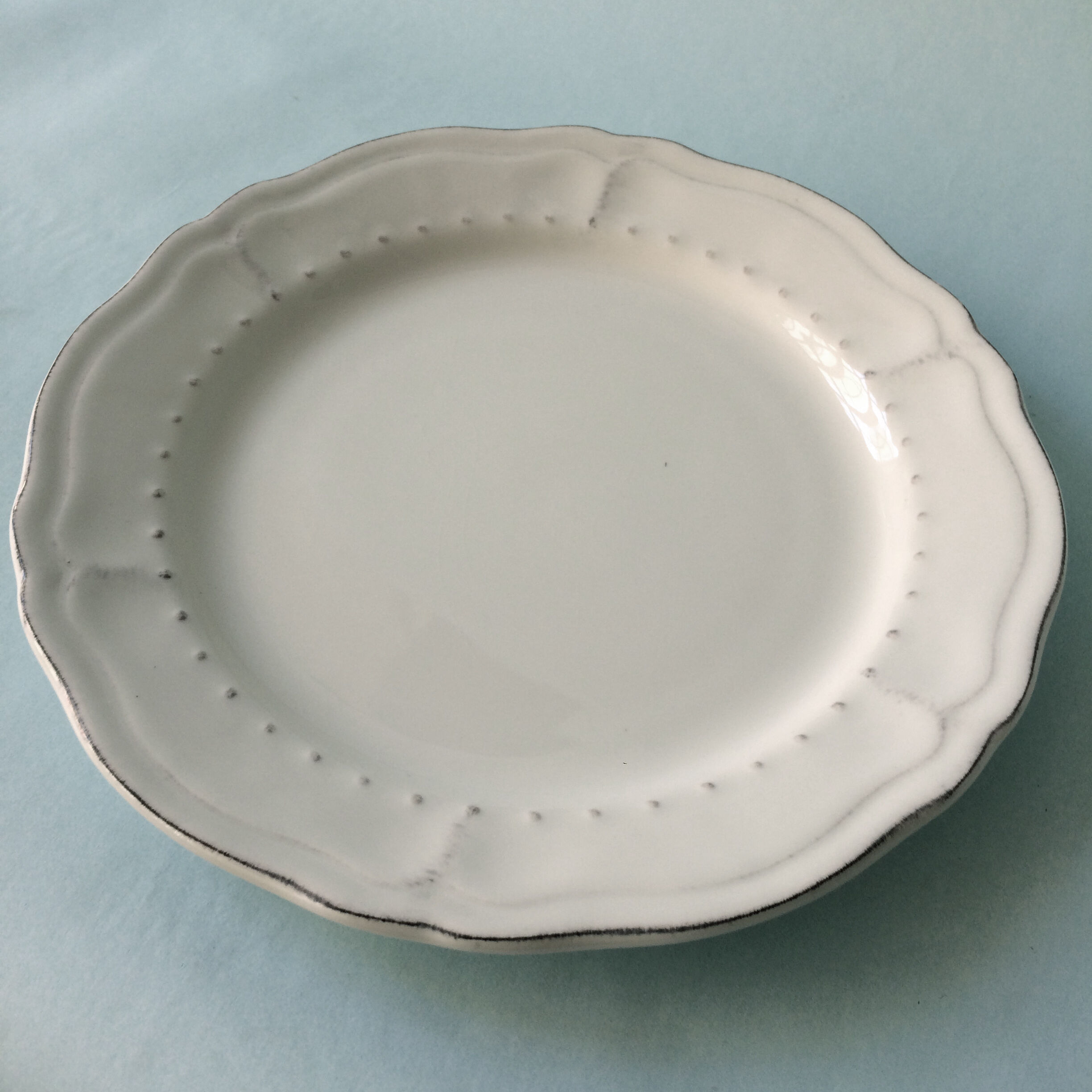 White plates in glazed red earth