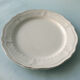 White plates in glazed red earth