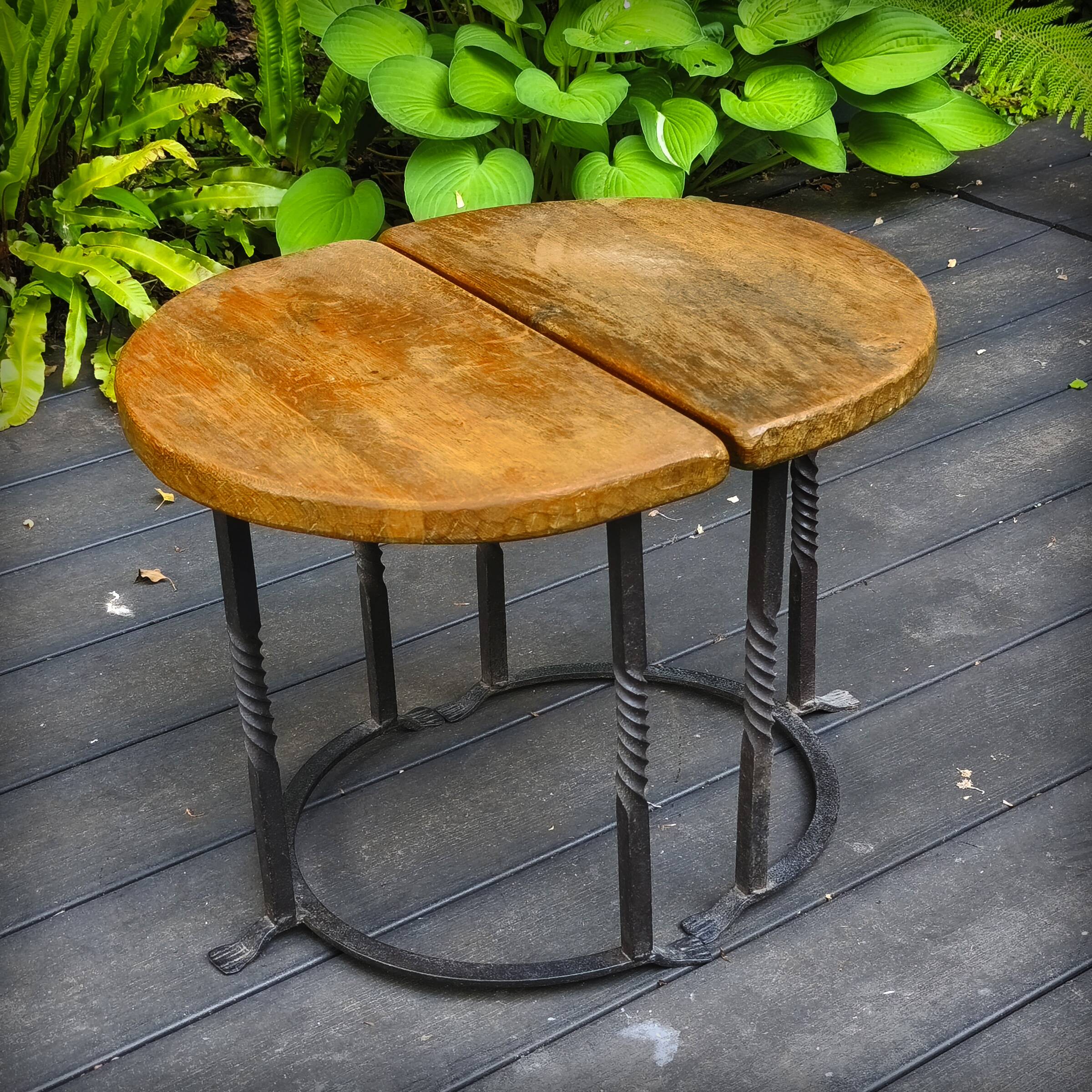 Pair of wrought iron and oak side tables, France, 1930.