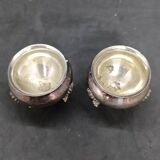 Pair of silver metal salt cellars with lion decor base