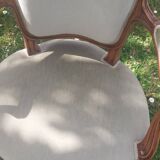 Pair of Rocaille style armchairs in green fabric and walnut, 19th century