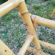 4 bamboo armchairs and a vintage coffee table