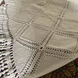 White cotton crochet bed cover with squares